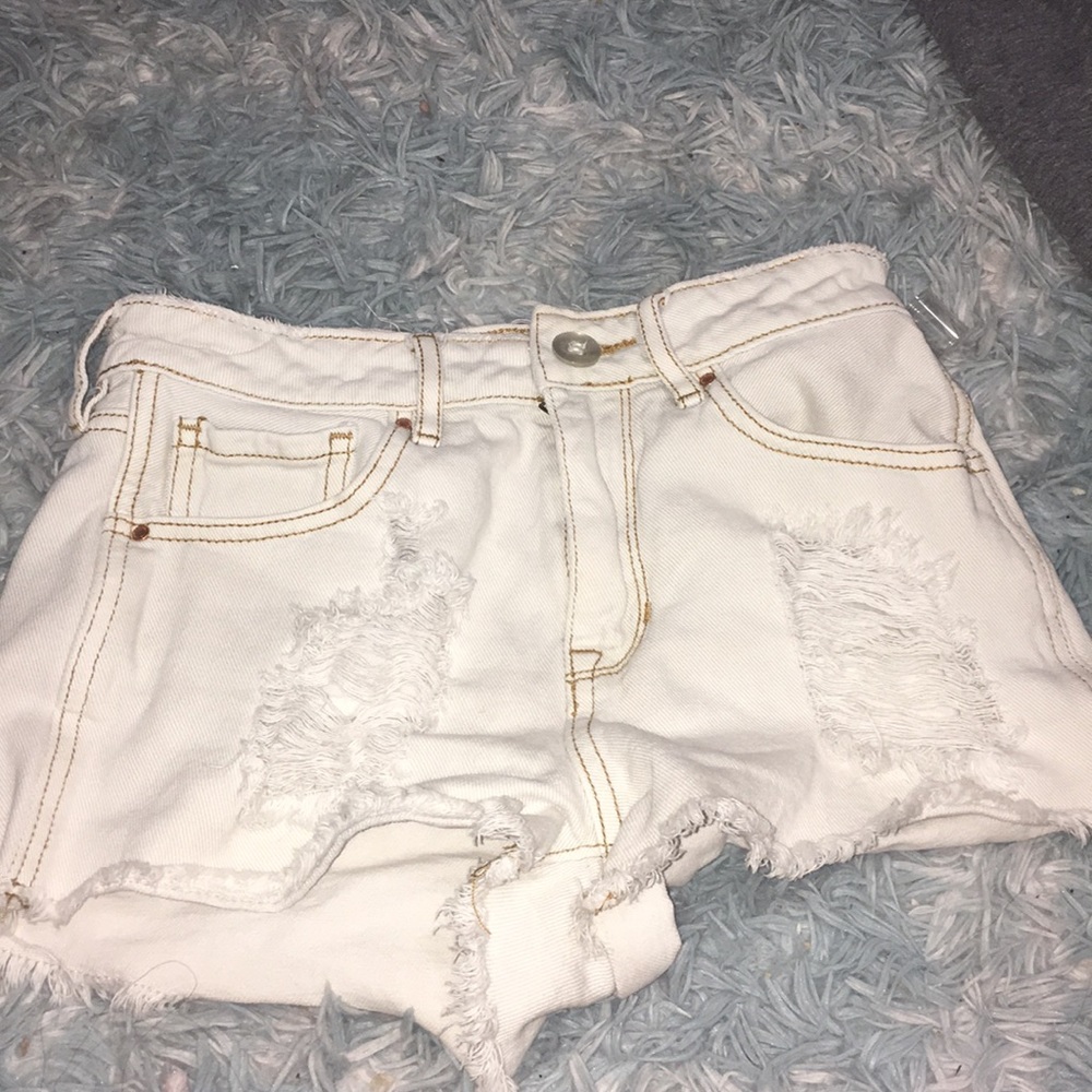 Women white ripped shorts